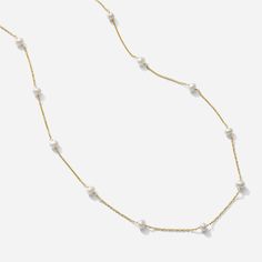 The Pearl Necklace as seen on a white background by Katie Dean Jewelry. Made in America. White Pearl Chain Jewelry For Everyday Elegance, Feminine Pearl Drop Necklace, Feminine Pearl White Pearl Necklace, Elegant White Necklace With Delicate Chain, Chic Everyday Pearl Necklace, Chic Pearl White Necklace With Pearl Charm, Gold Single Strand Chic Pearl Necklace, Chic Gold Single Strand Pearl Necklace, Feminine White Jewelry With Pearl Chain