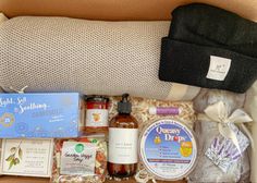 This package includes all the comfy necessities when you need them the most.  A care package gift set that includes comfortable and practical items that are very helpful for those going through a difficult season of life.  The fleece lined blanket, black beanie, spa eye mask are all items that will bring warmth and coziness to the gift receiver. The soups, crackers and honey are all items that they can snack on or easily prepare.  The body lotion is a nice addition for self-care. Season Of Life, Birthday Gift Baskets, Veggie Soup, The Comfy, Blanket Black, Black Beanie