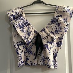 Blue & White Bubble Sleeve Tank Top With Bow Detail From Anthropologie. Cropped Blue Floral Print Blouse, Blue Floral Print Cropped Blouse, Blue Cropped Blouse With Floral Print, Elegant Blue Crop Top, Elegant Cropped Blue Tops, White Lace Shorts, Top With Bow, White Floral Top, Pattern Blouse