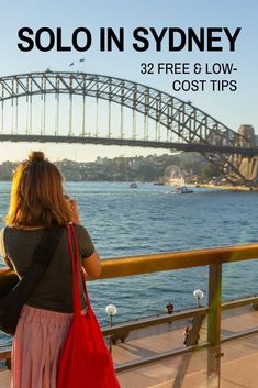 a woman is looking out over the water with a bridge in the background and text that reads solo in sydney 32 free & low cost tips