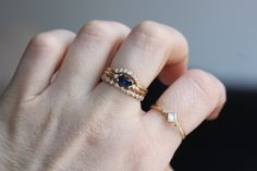 "Loving this beautiful Blue Sapphire. This ring is perfect as a gift, something blue, or as an engagement ring for the girl that wants something different. - 6x4mm Blue Sapphire center stone - 1.3mm side diamonds (.02 Ct total) - 1.3mm round band - Available in 14K yellow, white or rose gold Pairs perfectly with our seven diamond \"Crown\" wedding band! Click here: https://www.etsy.com/listing/555115894/14k-gold-diamond-curved-wedding-band?ref=shop_home_active_1 Processing Times - Current proces Elegant Round Cut Blue Stackable Rings, Blue Marquise Cut Rings With Rose Cut Diamonds, Elegant Everyday Blue Sapphire Ring, Elegant Blue Stackable Birthstone Rings, Elegant Blue Birthstone Stackable Rings, Classic Blue Stackable Wedding Rings, Delicate Blue Anniversary Rings, Blue 14k Gold Stackable Rings For Wedding, Oval Sapphire Stackable Rings For Gift