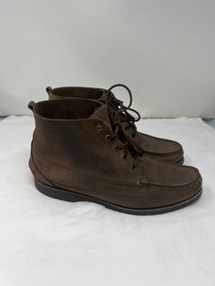 "1990s Florsheim Outdoorsman's Hiking Boots SIZE: US MEN 10  WIDTH: 4 1/4\" LENGTH HEEL TO TOE: 11 1/2\"\" HEIGHT: 6\" HEEL: 1\" MATERIAL: Leather  COLOR: Brown NOTE: Shoes show signs of wear on soles, heels and uppers consistent to pre-owned shoes. Made by Florsheim" Casual Chukka Boots With Steel Toe And Moc Toe, Casual Steel Toe Moc Toe Chukka Boots, Vintage Fall Work Boots With Moc Toe, Vintage Boots With Leather Footbed And Moc Toe, Vintage Brown Work Boots With Reinforced Heel, Vintage Ankle Work Boots With Leather Footbed, Vintage Lace-up Work Boots With Reinforced Heel, Vintage Lace-up Chukka Boots For Fall, Vintage Brown Snip Toe Chukka Boots