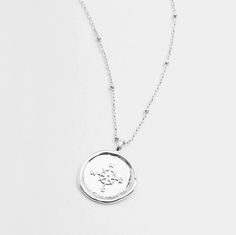 Gorjana's design with the aesthetic of a found object, this unique coin necklace has the feel of a family heirloom. This coin charm centers on an ever-so-dainty ball chain that effortlessly elevates your layered look. Chain extends out to 19" Coin is 3/4" across Spring ring closure Silver plated brass Lifetime manufacturer's warranty Avoid contact with anything containing derivatives of alcohol Coin Necklace Silver, Gorjana Necklace, Gorjana Jewelry, Silver Coin Necklace, Gold Coin Necklace, Coin Necklace, Family Heirloom, Found Object, Silver Coins