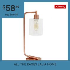 a table lamp with a price tag for $ 59 99 reg $ 600 00 all the rages laia home