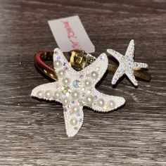 Beautiful Bracelet From Betsey Johnson. Gold Tone Band With Sparkling White Starfish On Them. Starfish Have Rhinestones And Sparkle. Both Glamorous And Whimsical. Great For Summer Beach Looks. White Star-shaped Ocean-inspired Jewelry, Ocean-inspired White Star-shaped Jewelry, Ocean-inspired White Star Jewelry, White Star-shaped Jewelry With Starfish Charm, White Starfish Pendant Ocean-inspired Jewelry, Adjustable White Jewelry With Starfish Charm, White Ocean-inspired Jewelry With Starfish Charm, Ocean-inspired White Jewelry With Starfish Charm, Summer Beach Looks