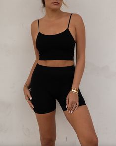 ~ 92% Nylon 8% Spandex ~ Seamless ~ Semi-open back ~ Model is 5'9" wearing a size S/M Black Stretch Crop Top With Built-in Bra, Stretch Seamless Tank Top For Night Out, Black Seamless Sports Bra With Spaghetti Straps, Black Stretch Cami Crop Top, Black Seamless Tank Top For Night Out, Stretch Black Crop Top With Built-in Bra, Black Stretch Camisole With Built-in Bra, Black Compressive Crop Top For Summer, Black Seamless Crop Top For Summer