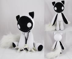 the stuffed animal is black and white in color