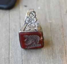 Vintage Afghan carved Intaglio Carnelian gemstone size 8 1/2 ring silver/brass. Handmade high-mount Tribal Afghan Silver ring is substantial weighing 9.8 grams. Arabic Silver (Not Sterling) Jewelry.  Ring is in Very nice vintage condition...would make a great gift or lovely addition  to any jewelry collection. -Great Detail! -Comes in Jewelry gift box. Free domestic shipping! Returns & exchanges: Returns accepted within 30 days of the purchase of the item. However, the buyer is responsible for shipping the item back to us and that cost will not be refunded. We will refund your money for the item as soon as we receive the item back. Please send the item back to us with tracking. Vintage Afghan, Sterling Jewelry, Jewelry Ring, Jewelry Gift Box, Ring Silver, Rings Statement, Vintage Men, Jewelry Gift, Statement Rings