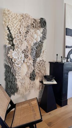 a wall hanging made out of different types of fabric