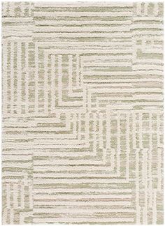 an area rug with white, green and beige stripes on the floor in front of a white background