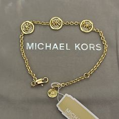 Nwt. Nwp Designer Gold Jewelry With Logo, Classic Gold Jewelry With Logo, Elegant Gold Jewelry With Logo, Michael Kors Luxury Timeless Jewelry, Classic Round Michael Kors Jewelry, Luxury Michael Kors Elegant Jewelry, Luxury Gold-tone Jewelry With Logo, Luxury Gold-tone Logo Plaque Bracelet, Gold-tone Bracelet With Logo Charm