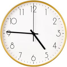 a white clock with black hands and numbers on the face is shown against a white background