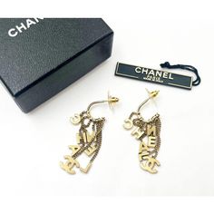 This is part of Chairish’s Costume Jewelry assortment.  Chanel Rare Vintage Gold CC Letter Dangle Hoop Earrings  *Marked 02 *This early style doesn't come with the hallmark. *Comes with the original box and the tag with style number  -It is approximately 2" x 0.5". -It is very rare and beautiful. -In an excellent condition Designer Dangle Earrings For Formal Events, Designer Dangle Earrings For Formal Occasions, Designer Metal Drop Earrings, Designer Dangle Earrings For Gift, Designer Pierced Dangle Jewelry, High-end Gold Earrings For Gift, Designer Single Metal Earring, Luxury Dangle Hoop Earrings, Designer Hoop Earrings For Gift