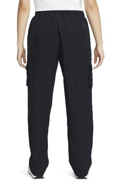 Cargo pockets and a relaxed fit give your off-duty look a utilitarian finishing touch in woven sweatpants finished with an adjustable drawcord waist. 100% nylon Machine wash, tumble dry Imported Nike High, Cargo Trousers, Nike Black, Off Duty, Nike Sportswear, Black Nikes, Cargo Pants, Nike Women, High Rise