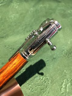 a close up view of a wooden handle on a water - based object in the ocean