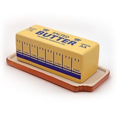 a yellow butter container sitting on top of a tray