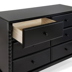 a black dresser with two drawers and an open drawer