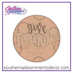 a cookie with the words give thanks written in cursive writing on it and purple border