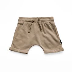 Unlock the ultimate wardrobe essential for your child: The Taupe Harem Shorts by Lenox James. Crafted with comfort and style in mind, these versatile shorts offer endless possibilities for mixing and matching to maximize wear. A chic taupe color that adds a sophisticated touch to any outfit, seamlessly blending with other pieces in your child's wardrobe. The trendy harem style, complemented by an elastic waistband and functional drawstring for the perfect fit, allowing easy pairing with various Most Comfortable Jeans, Harem Shorts, Taupe Color, Gifts For Adults, Basic Tees, Endless Possibilities, Above The Knee, Summer Collection, Wardrobe Essentials