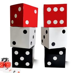 two dices are stacked on top of each other with red and white polka dots