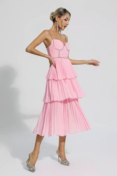 The Meredith Pink Diamond Ruched Midi Dress is sure to wow the crowd at your next special event! Cut from high-quality pleated fabric, diamond-embellished suspenders, meticulous tailoring, bringing charming details. The high-waisted design and loose skirt easily flatter your figure. Pair it with high heels for a party-ready look.  Dress Length: Approx 117cm Materials: Polyester Gentle Dry Clean Only  The model is 5 ft 7 and wears size S  Color may vary due to lighting on images. The product imag Ruched Midi Dress With Ruffled Straps For Party, Party Midi Dress With Ruched Details And Ruffled Straps, Party Midi Dress With Ruched Ruffled Straps, Glamorous Pleated Midi Dress, Ruched Tiered Dresses For Gala, Tiered Ruched Dresses For Gala, Ruched Gala Dress With Ruffled Straps, Glamorous Pleated Midi Dress For Cocktail, Glamorous Pleated Midi Cocktail Dress