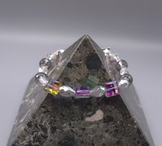 Iridescent crystal beads and crystals with bead caps and silver spacers. Heart toggle clasp. Bracelet is 8 inches long. Toggle Clasp Bracelet, Iridescent Crystal, Clasp Bracelet, Crystal Bracelet, Bead Caps, Toggle Clasp, Crystal Bracelets, Crystal Beads, 20 Cm