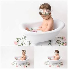 a baby sitting in a bathtub with flowers on it