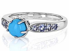 6mm Round Cabochon Sleeping Beauty Turquoise With 0.27ctw Round Tanzanite Rhodium Over Sterling Silver Ring. Measures Approximately Turquoise Multi-stone Round Gemstones, Turquoise Multi-stone Gemstones, Turquoise Jewelry With Center Stone, Anniversary Turquoise Ring With Gemstone Accents, Yellow Watches, Ring Spacer, School Jewelry, Popular Jewelry, Sleeping Beauty Turquoise