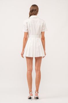 The White Romper Dress is a versatile addition to any wardrobe. Made from 100% cotton, this dress features a stylish wrap design, a pleated skirt, and a classic collar. With its mini length, it is perfect for both casual and formal occasions. Stay comfortable and chic in this must-have dress. collared wrap style romper dress (shorts built in) hand wash cold / line dry model is 5'11" and is wearing a size small Curvy Date Night Outfit, White Romper Dress, White Pleated Dress, Air Clothes, Valentines Day Dresses, Mini Dress White, Dress Pleated, Dress Shorts, Pleated Mini Dress