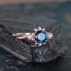 Rose Gold And Pearl Blue Topaz Engagement Ring Infinity Wedding Band Akoya Pearl Birthstone June Bridal Ring Diamond Women Anniversary Gift Same Design with difference gemstone: https://www.etsy.com/listing/612889885 https://www.etsy.com/listing/606125915 https://www.etsy.com/listing/599049598 ITEM INFORMATION: Metal Type- Solid 14K Rose Gold Ring Size Available- US3# -10# *Engagement Ring Details： WIDTH-( approx. 2.3mm ) 1.Center Stone- 6mm Natural Blue Topaz, Round Cut 2.Side Stones - Natural Blue Pearl Engagement Ring, Sapphire Pearl Engagement Ring, Elegant Topaz Ring With Prong Setting For Wedding, Elegant Topaz Wedding Ring With Prong Setting, Elegant Wedding Topaz Ring With Prong Setting, Elegant Blue Bridal Sets Gift, Elegant Diamond Topaz Wedding Ring, Rose Gold Topaz Ring With Diamond Accents For Wedding, Wedding Topaz Ring Fine Jewelry