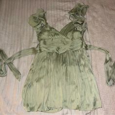 “Silk-Like” Mint Green Baby Doll Dress With Ruffle Sleeves And Tie Back. Never Been Worn. Purchased From Highland Park Boutique. Green Flowy Mini Dress For Evening, Flowy Green Mini Dress For Evening, Green Sleeveless Evening Blouse, Dressy Silk Mini Dress For Summer, Spring Silk Mini Dress With Ruffles, Silk Flowy Party Blouse, Silk Flowy Blouse For Party, Flowy Silk Party Blouse, Flowy Silk Sleeveless Mini Dress