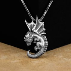 Dragon Pendant, Baby Dragon Unique Silver Necklace, Silver Mythology Jewelry, Cute Winged Baby Dragon Pendant, Dragon Necklace, Gift For Mom Made of 925 silver and handcrafted by hand, this ring is not only an accessory piece that complements your daily elegance, but also has details that will reflect your character and style. It is also a great gift to give to your loved ones on their special days. At SavisSilver, we always give importance to the satisfaction of our customers, we recommend you Adjustable Sterling Silver Dragon Jewelry, Adjustable Sterling Silver Jewelry With Dragon Design, Adjustable Dragon Design Necklace As A Gift, Adjustable Dragon Design Necklace For Gift, Themed Sterling Silver Necklace, Adjustable Themed Sterling Silver Necklace, Themed Sterling Silver Nickel Free Necklaces, Themed Sterling Silver Necklace In Silver, Collectible Themed Jewelry Pendant