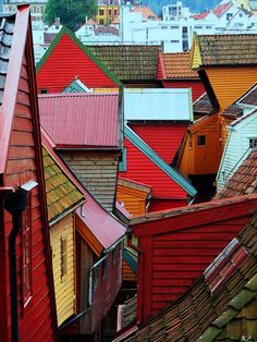 many red and yellow houses are shown in this view from the top of a hill