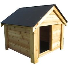 a wooden dog house with a black roof