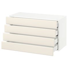 three white drawers are stacked on top of each other, with one drawer open and the other closed