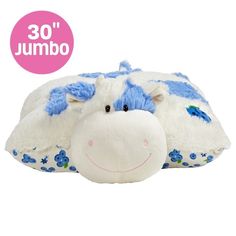 a white and blue stuffed animal laying on top of a pillow