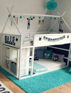 a child's bedroom with a loft bed and blue rugs