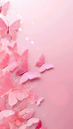 some pink butterflies flying in the air