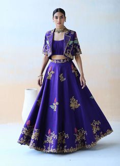 Editor's Note A Purple Lehenga Set In Dupion Silk Base Featuring Multicolor Floral Thread Embroidery Highlighted With Sequins, Cut Dana And Various Other Embellishments. It Is Paired Up With An... Lehenga For Petite Women, Purple Ghagra, Lehenga Embroidery Design, Lehenga Inspiration, Orang India, Jacket Lehenga, Purple Lehenga, Luxury Pret, Lehenga Designs Simple