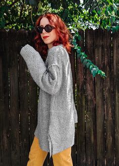 Classic slouchy, super oversized sweater that's perfect for lazy weekends and days when you just wanna be extra cozy. Features a ribbed crew neckline, reverse seams along the drop shoulders, side slits, and ribbed cuffs and hem. Extra long length so it's great to throw on over leggings. Super super nubby textured fabric in a grey colorway. Also available in black and candy pink. Features: Slouchy, oversized sweater Drop shoulders Reversed seams along the shoulders Ribbed crew neck Ribbed cuffs a Knit Oversized Sweater, Ankle Length Skirt, Ragged Priest, Oversized Knitted Sweaters, Skirt Jumpsuit, Candy Pink, Sock Gifts, Girl Bands, Dress Pant