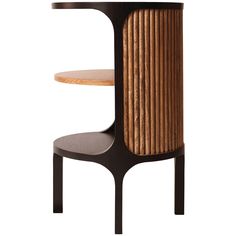 the side table is made out of wood and has a curved wooden shelf with two shelves on