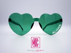 This listing is for a pair of personalized Heart shaped tinted glasses. xx Customize with your own text to make these a fun gift for all kinds of occasions! xx Your text will be added in your choice of White or Black vinyl xx Non-Polarized xx Color: Green xx One size fits most xx Dimensions:  Front Width: approx 5.6 inches Temple Length: approx 5.5 inches xx Material: Plastic Please message if you have questions! Valentines Glasses, Green Heart Sunglasses, Heart-shaped Sunglasses With Tinted Lenses For Gift, Sunglasses Bride, Heart-shaped Sunglasses With Heart Print For Summer, Trendy Heart-shaped Sunglasses With Heart Print, Heart-shaped Plastic Sunglasses With Mirrored Lenses, Tinted Glasses, Heart Glasses