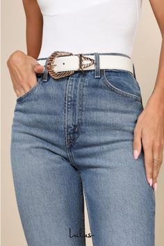 Say ""howdy"" to the endless array of iconic ways to style the Petit Moments Modern Rodeo White Western Belt! This cute belt is ready to giddy-up with its faux leather construction that shapes a Western-inspired silhouette with a shiny, oversized gold buckle with a twisted design and a matching tip. Pair to perfection with all of your favorite blue denim! Size XS/S measures 1. 25" wide. Belt adjusts between 28" and 34" with 7 hole adjustments. Size M/L measures 1. 25" wide. Belt adjusts between 31. 25" and 37. 25" with 7 hole adjustments. 100% PU Leather. Buckle 100% Zinc. Imported. Lulus | Modern Rodeo White Western Belt. Trendy Fall Belt Buckles, Adjustable Belt With Buckle Closure For Fall, Trendy Adjustable Belts For Fall, Chic White Belt For Spring, Trendy Belt Buckles For Fall, Chic Fitted Belt With Buckle Closure, Trendy Adjustable Belts For Spring, White Adjustable Belt For Spring, Adjustable White Belt For Spring