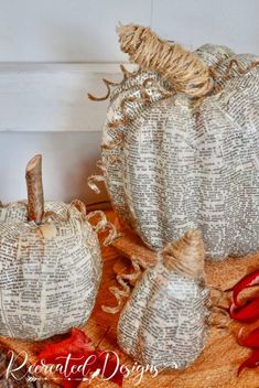 two white pumpkins sitting on top of a table