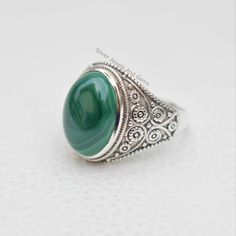 Gemstone-Malachite Shape-Oval Stone Size- 10x14 MM Metal-925 Sterling Silver This One of a kind ring is adorned with beautiful rich green color Malachite Gemstone set in sterling silver band. Malachite is the birthstone associated with the Scorpio,zodiac sign About gemstone- Malachite is vibrant green color stone which can bring transformation by assisting one in changing situations..The green color of this stone is the color of abundance of spirit and prosperity.Malachite act as guardian of the Silver Malachite Gemstone Ring, Malachite Rings Suitable For Gifts, Malachite Rings As Gifts, Malachite Rings Gift, Oval Malachite Gemstone Jewelry, Silver Malachite Rings As Gift, Oval Malachite Emerald Ring, Green Oval Rings With Natural Stones, Oval Emerald Ring With Natural Stones In Sterling Silver