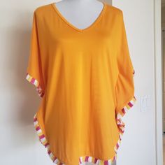 Never Been Worn Beautiful Orange Top With Pink And White Fringe On Seams Striped Stretch Tops For Beach, Striped Stretch Tops For The Beach, Yellow Summer Top For Beach Cover-up, Yellow Summer Tops For Beach Cover-up, Yellow Summer Beach Cover-up Top, Yellow Beachwear Top For Day Out, Stretch Orange Tops For Beach, Front Twist Top, Hooded Tunic