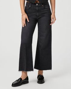 This modern high-waisted wide leg has an easy, relaxed fit and an ankle length silhouette. This style is cut from our PAIGE Vintage denim and comes in a vintage black wash with whiskering, fading, and a raw hem. PAIGE Vintage takes all of the work out of breaking in your favorite pair of vintage jeans. We've combined the comfort of stretch with everything you love about authentic vintage denim to create super soft jeans that feel perfectly lived-in from the very first wear. | Anessa Wide Leg Jea Black High-rise Cropped Jeans With Frayed Hem, High Rise Black Cropped Jeans With Frayed Hem, Black High Rise Cropped Jeans With Frayed Hem, Fall Wide Leg Cropped Jeans With Frayed Hem, Wide Leg Cropped Jeans With Frayed Hem For Fall, Black Cropped Jeans With Frayed Hem For Fall, Wide-leg Washed Cropped Jeans For Fall, Black Wide Leg Flare Jeans With Frayed Hem, Fall Washed Wide Leg Cropped Jeans