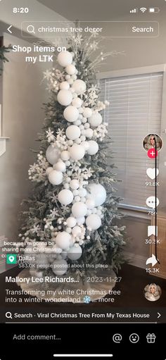 the christmas tree is decorated with white ornaments