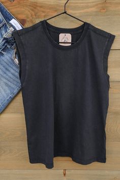 Brenn Sleeveless Top in Black Shadow The Brenn sleeveless top is cute in a great tone of black shadow offering style with comfort. This top features sleeveless, crew neck, and banded sleeves and neck. Perfect for dressing up or down. Pair with your favorite denim jeans or shorts or layer with a favorite top! Product Details Sleeveless Crew Neck Ribbed Fabric Sizing - Small, Medium, Large Fabric - 100% Cotton Fit - True to Size Care - Machine wash cold, hang or lay flat to dry. Shipping - Our sto Dark Wash Sleeveless Casual Top, Black Muscle Tee For Spring, Black Relaxed Fit Muscle Tee For Everyday, Basic Black Washed Tops, Basic Black Washed Top, Spring Black Crew Neck Muscle Tee, Black Crew Neck Muscle Tee For Spring, Washed Black Crew Neck Muscle Tee For Summer, Summer Washed Black Crew Neck Muscle Tee