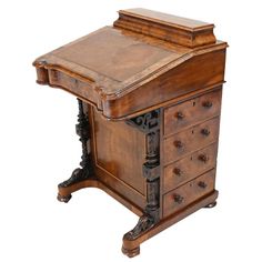 an old wooden desk with drawers on the top and bottom, in front of a white background